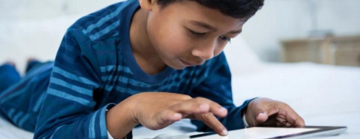 young boy on tablet