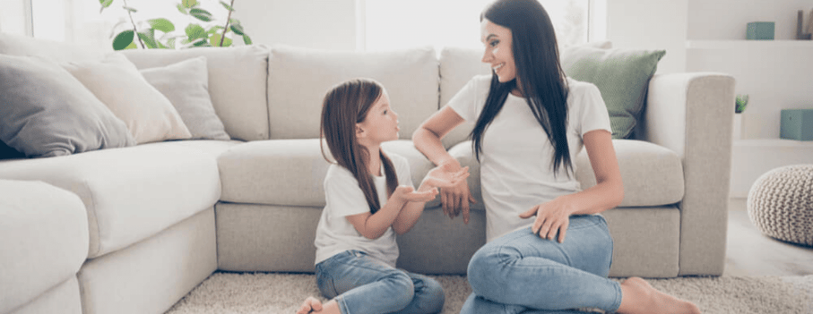 mother and young daughter talking