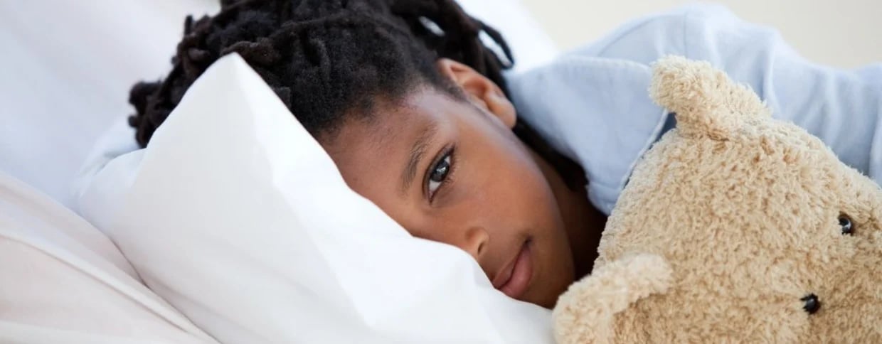 Young Boy in Hospital  hugging his teddy bear-034113-edited