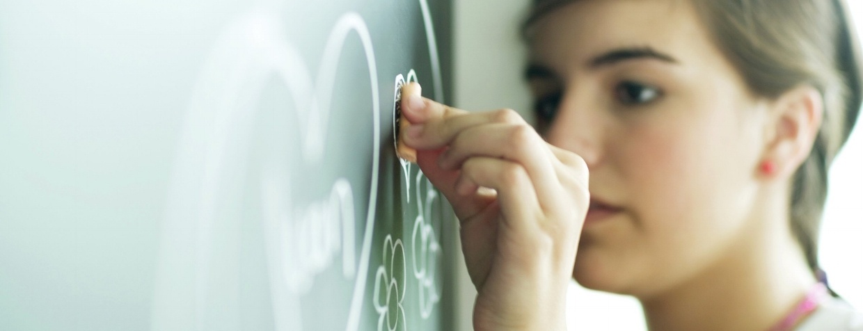 Child drawing on chalkboard-1