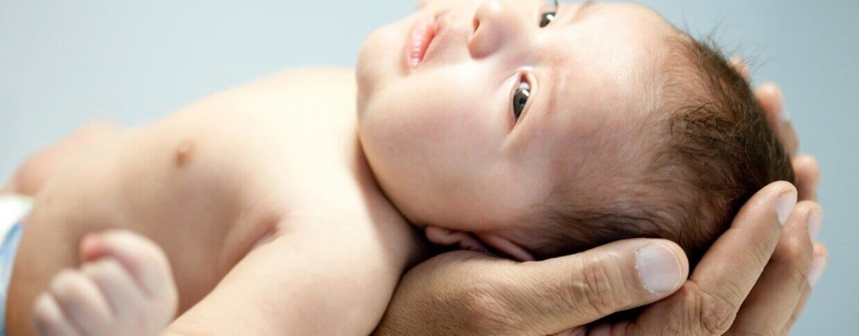 Portrait of a man holding a baby in his hands-924309-edited