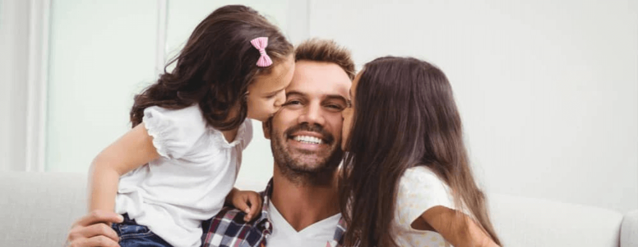 father with his two daughters