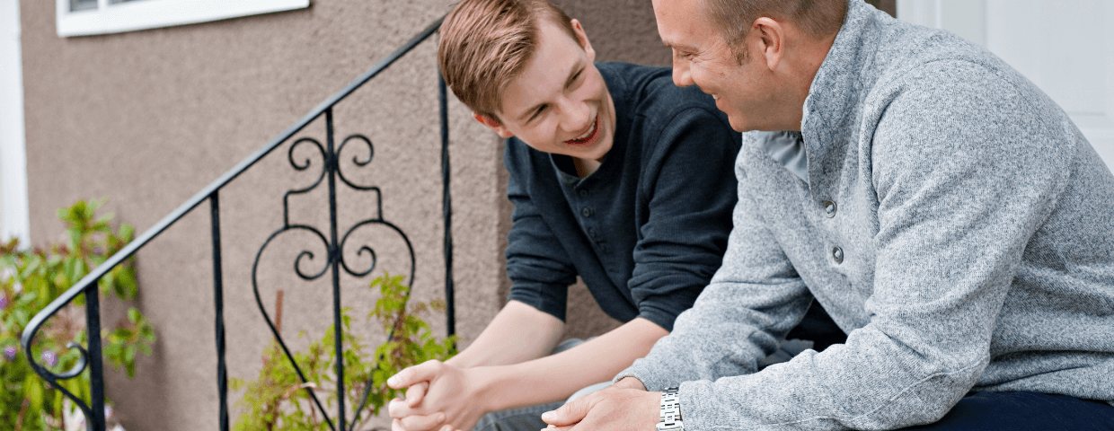 Teen boy talking to his dad