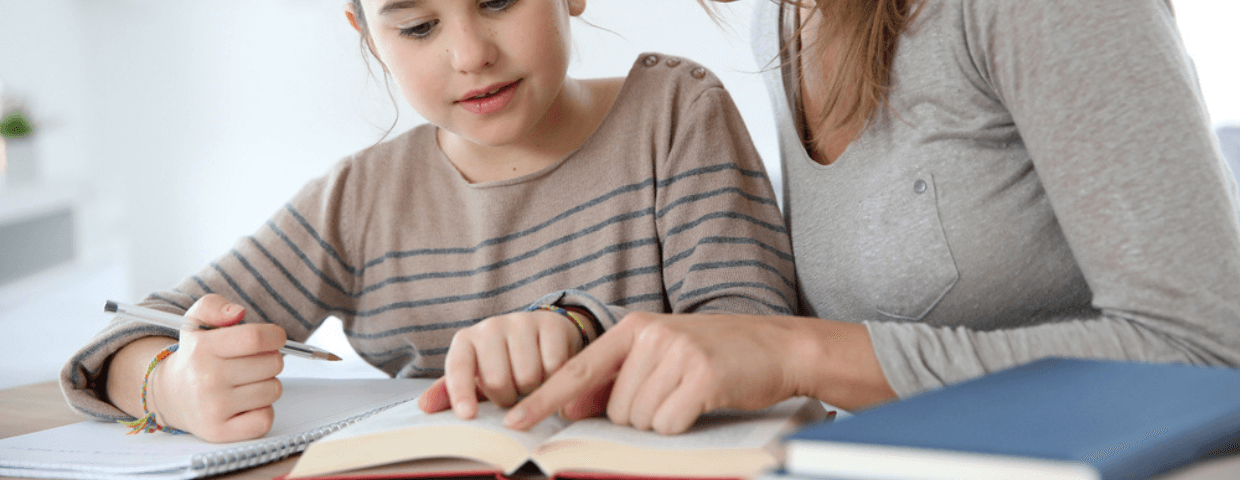 mother helping daughter with homework