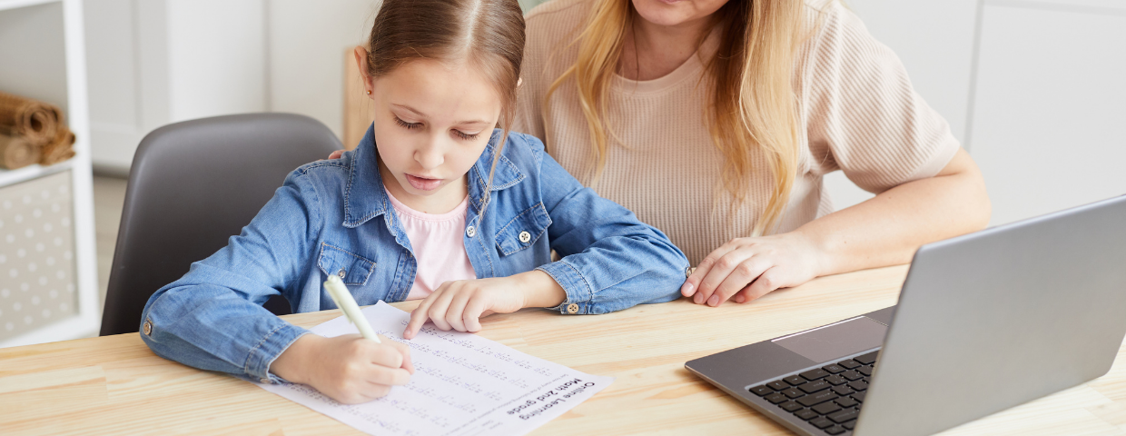 mother helping daughter with homework