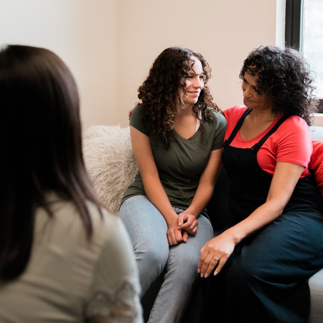 A supportive moment between a family and care team